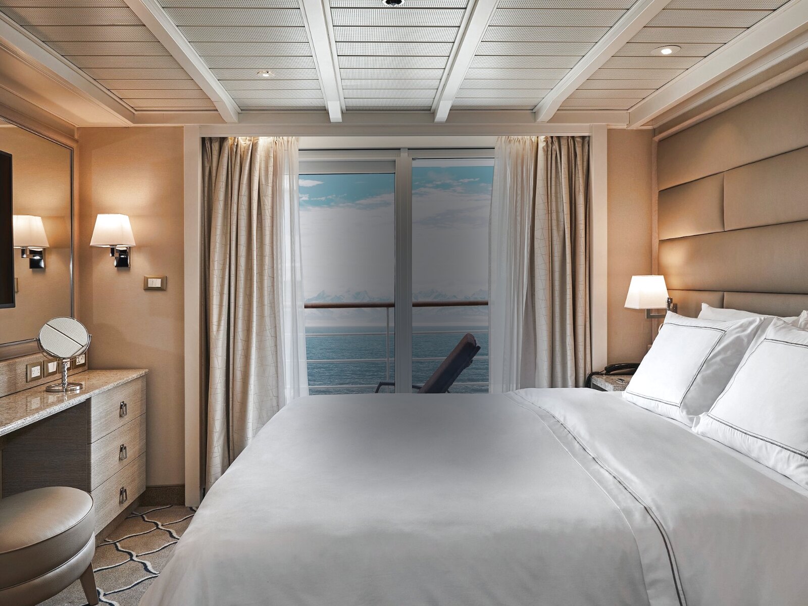 Premium suite interior with private balcony and ocean view