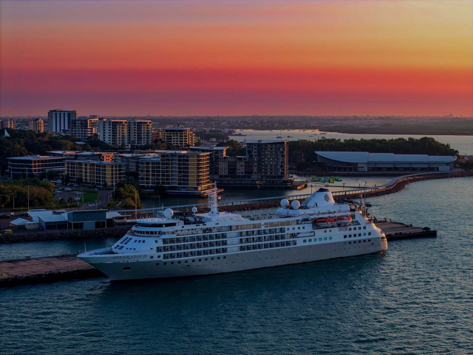 Silver Cloud expedition vessel at sunrise in harbor